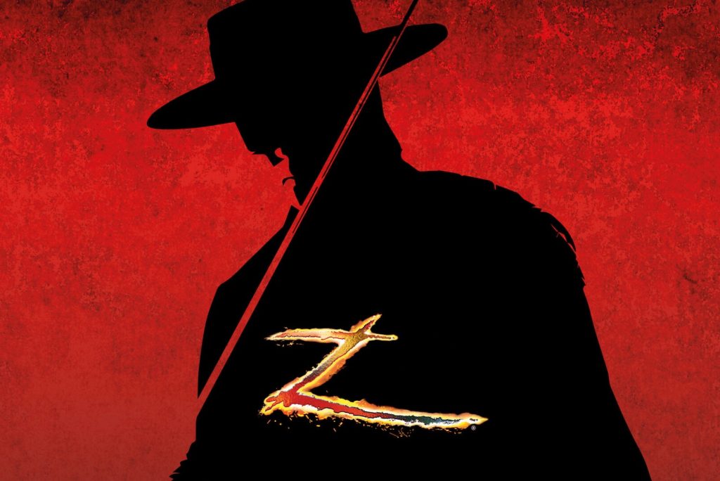 Schwarze Silhouette eines Mannes mit Hut vor rotem Hintergrund. Man sieht auch einen Degen und ein großes, goldenes „Z“ für Zorro © Harald Schillhammer
