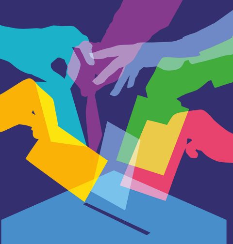 Illustration mit bunten Händen, die einen Wahlzettel in eine Wahlurne werfen.