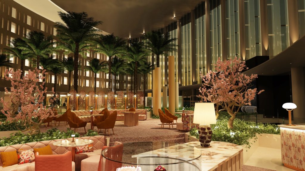 Lobby des Cityhotels Waldorf Astoria Cairo Heliopolis mit Sitzgelegenheiten und rund zehn Meter hohen Palmen