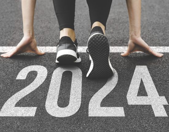 Woman's feet ont the road, begin to run, fstart of New year 2024, planning, goal, and new year resolution.